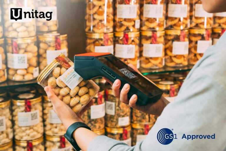Point of sale scanner reading a QR code on a product jar in store, Unitag platform approved by GS1
